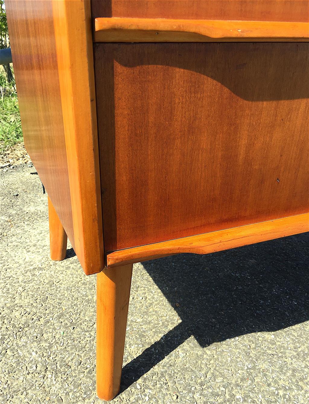 A mid century design mahogany and teak five drawer chest, circa 1960, width 77cm, depth 45cm, height 107cm